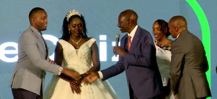 File image of President William Ruto and a wedded couple at KICC.